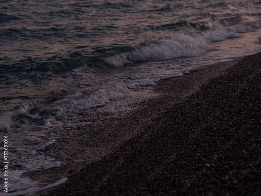 waves on the beach in the evening