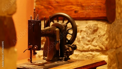 Vintage foot operated mechanical sewing machine from the late 19th century. Antique Seidel and Naumann Hand crank Transverse Shuttle Sewing machine. Istria, Croatia - November 25, 2023 photo
