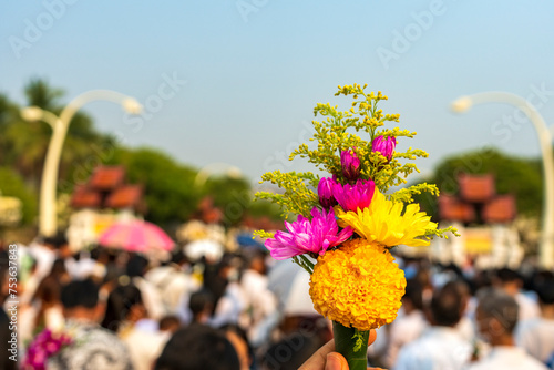 Man holding flower for worship the buddha. 