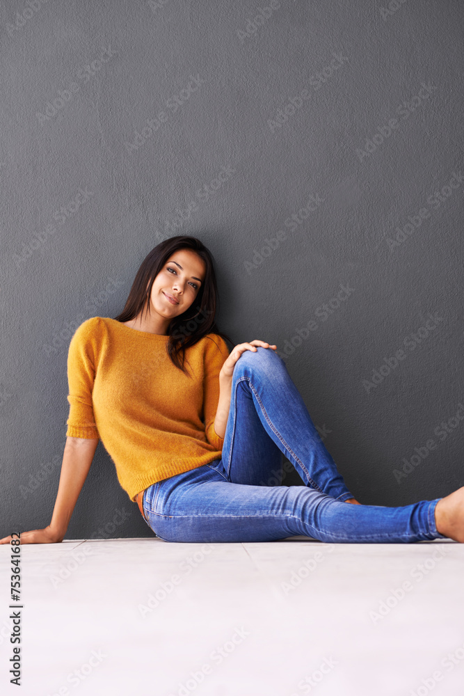 Portrait, woman and style on floor for leisure with casual outfit for fashion or comfort, relax and wellness with smile. Female person, isolated with grey background or wall for clothing with mockup. Portrait, woman and style on floor for leisure with casual outfit for fashion or comfort, relax and wellness with smile. Female person, isolated with grey background or wall for clothing with mockup.