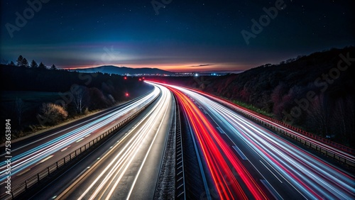 highway with car light trails at night. long exposure photo.
