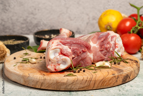 Lamb's shank. Butcher products. Lamb shank steak with bones on stone background photo