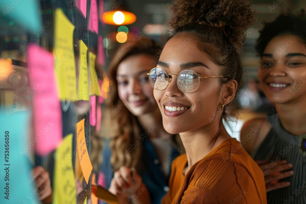 Enthusiastic young woman with glasses engaging in a brainstorming session Enthusiastic young woman with glasses engaging in a brainstorming session