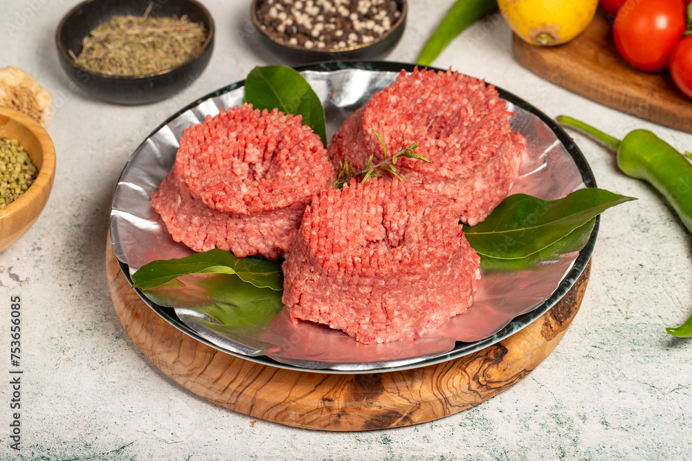 Ground beef. Butcher products. Raw ground beef on stone background Ground beef. Butcher products. Raw ground beef on stone background