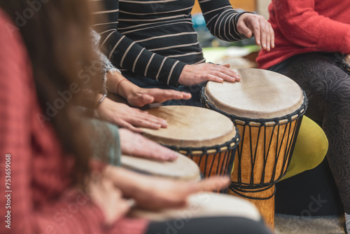 Music therapy concept, a group of people playing different types of musical instruments, music healing photo