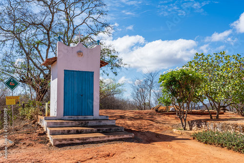 Little catholic chapel in a dry field in rural Brazil photo