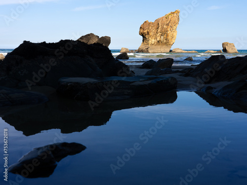 Canvastavla Aguilar beach betwen Cudillero and Muros de Nalon at sunset in Asturias, Spain