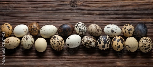 Quail eggs arranged on wooden surface