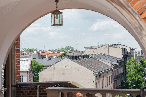Vintage Lantern Overlooking Old City Rooftops