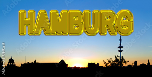 golden lettering "HAMBURG" on the sky above the silhouette of Hamburg at sundown, Germany