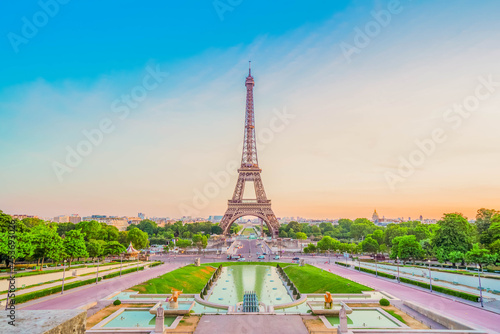 Paris Eiffel Tower and Trocadero garden at sunset in Paris, France. Eiffel Tower is one of the most famous landmarks of Paris., toned