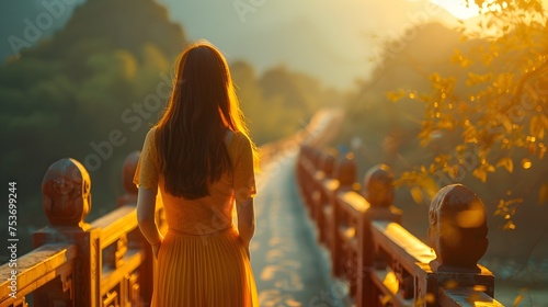 Woman Walking on a Bridge at Sunset