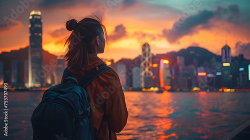 Woman Traveling in Hong Kong with Backpack during Sunset photo