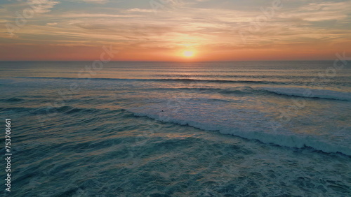 Golden sunset sky ocean horizon aerial view. Summer sundown reflecting in sea