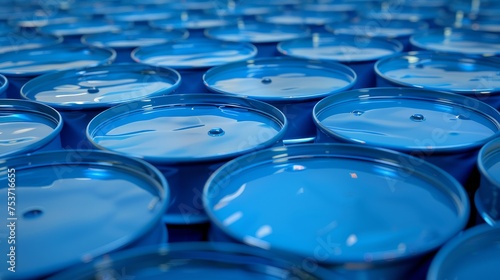 Many blue oil barrels in a line stock photo 