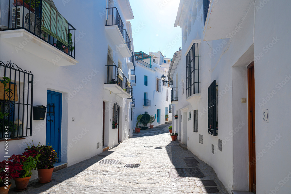 Narrow street in the white village of Frigiliana Spain