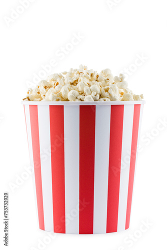 Popcorn in red and white striped container, isolated on white background.