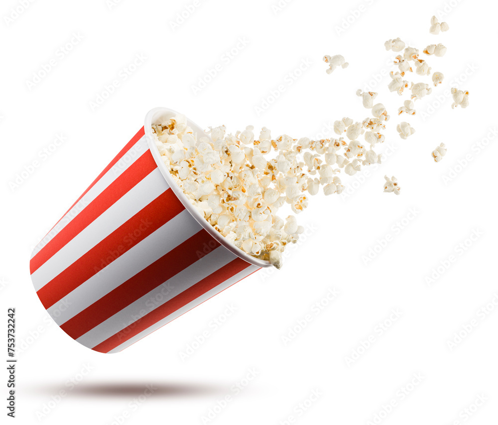 Popcorn flying from red and white striped container, isolated on white background.