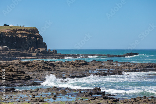 A view of the Pacific Ocean from a rare petrified forest in Curio Bay in the Southland District of southern New Zealand. The petrified conifers of the Jurassic forest are about 180 million years old. photo