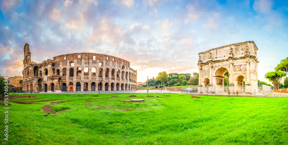 ruins of antique Colosseum and Arch of Constantine in sunise lights, Rome Italy