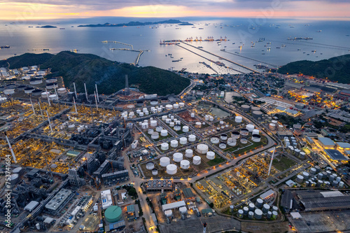 Aerial top view oil and gas refinery background, Business petrochemical industrial, Refinery oil and gas factory power and fuel energy, Ecosystem estates. Fuel refinery industry at night © boygek