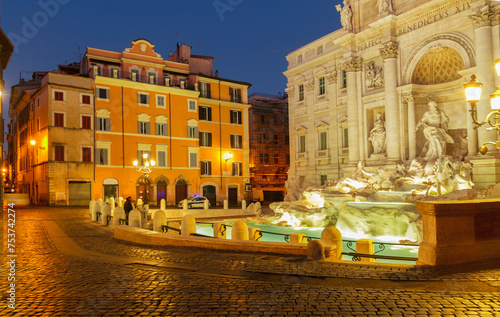 view of famous Fountain di Trevi in Rome illuminated at night, Italy
