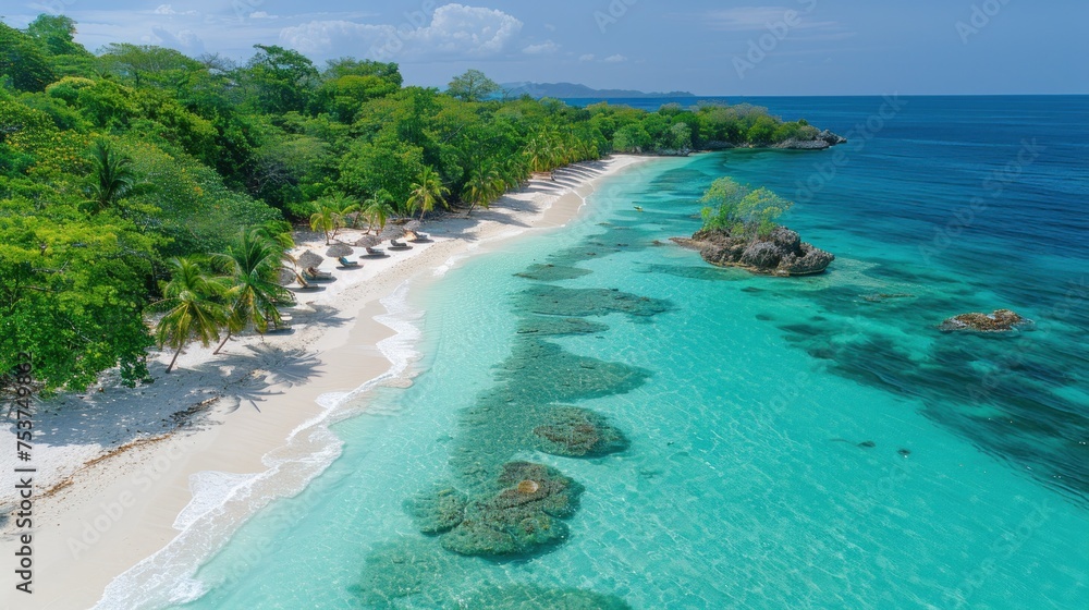an aerial view of a tropical island with a sandy beach and clear blue water, surrounded by lush green trees.