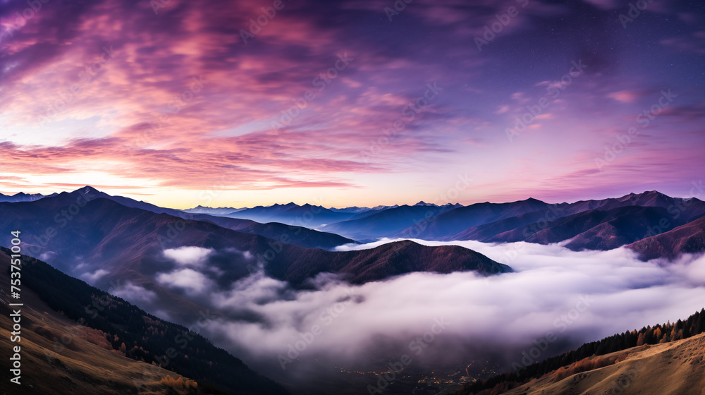 The mountains in fog at night, autumn landscape with alpine mountain valley, low clouds, purple starry sky. Best travel locations. Beautiful scenic