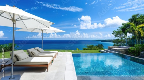 Luxurious Seaside Infinity Pool with Panoramic Ocean View and Lounge Area © romanets_v