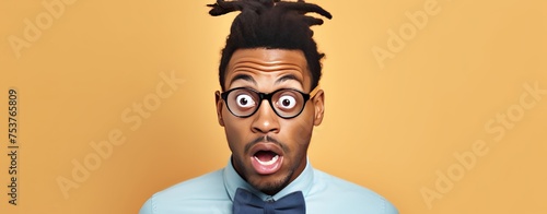 Surprised African American Man with braids, skeptical and sarcastic expression with an open mouth.