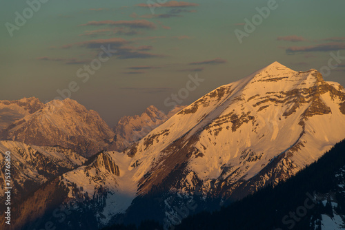 Die schneebedeckte Soiernspitze im Karwendel vor dem Wettersteingebirge bei Sonnenaufgang photo