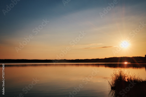 Sunset over the Lake - Landscape - Beautiful - Sunrise over Sea - Colorful - Reed - Clouds - Sky - Sundown - Sun © Enrico Obergefäll