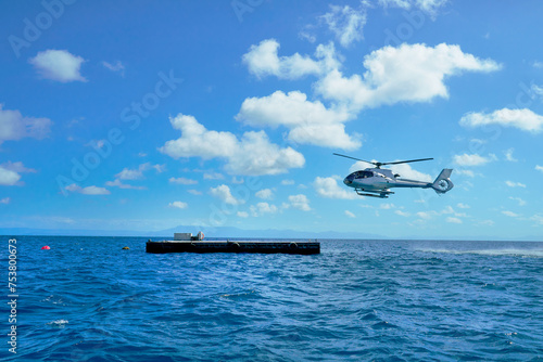 Helicopter landing at Great Reef for joy flight over the reef photo