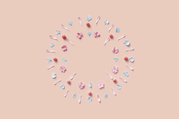 Festive frame of circle shape made of various flower petals