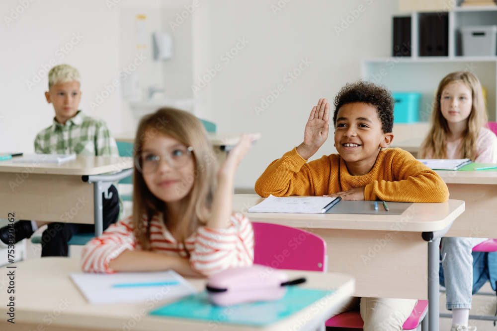 Students engaging in classroom activities Students engaging in classroom activities