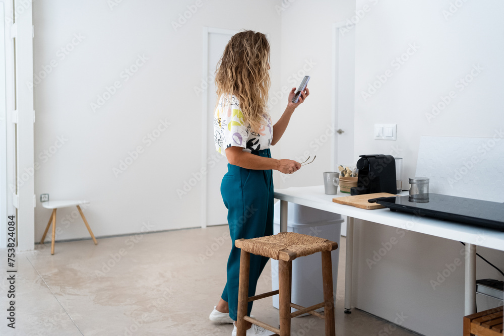Smiling Businesswoman Drinking Coffee In Office Corridor Smiling Businesswoman Drinking Coffee In Office Corridor