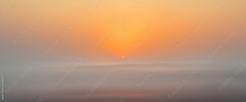 Abstract summer background with orange evening sky and fog below in the valley