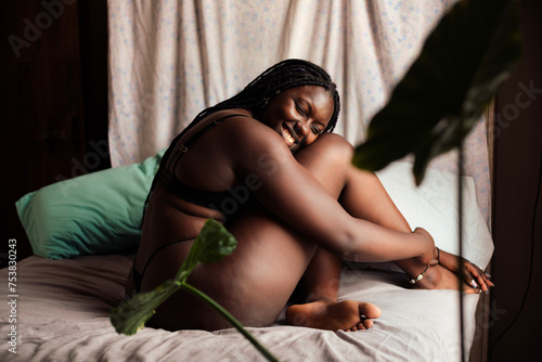Confident sexy black woman in underwear photo