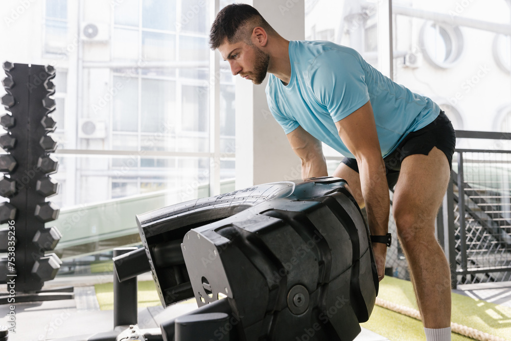 Strong athlete man exercise at the gym Strong athlete man exercise at the gym