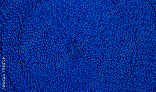Background of blue ribbon wound in a circle. View from above © Valeria F