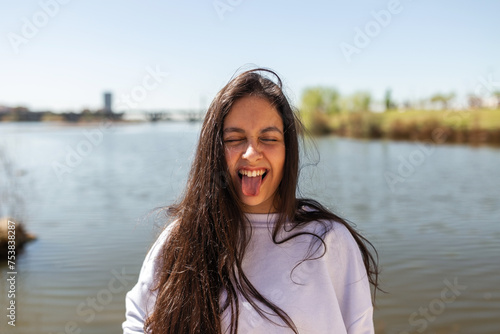 portrait of teenage girl making funny faces at camera