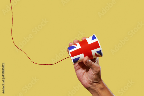 man holds an english string telephone