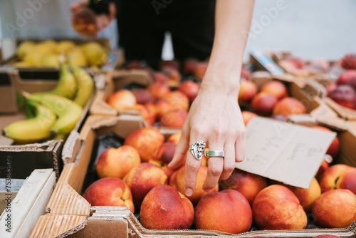 Hand picking fruit in farmer's market