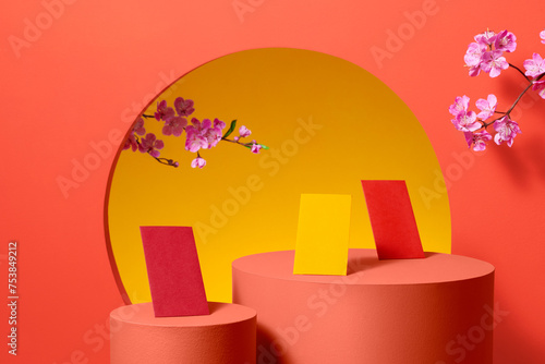 Red envelopes, flower branch and lucky ornaments for lunar new year photo