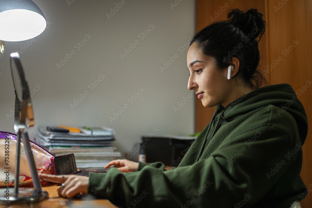 portrait of teenage girl with headphones in her bedroom portrait of teenage girl with headphones in her bedroom