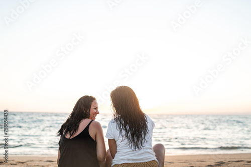 friends on the beach at sunset