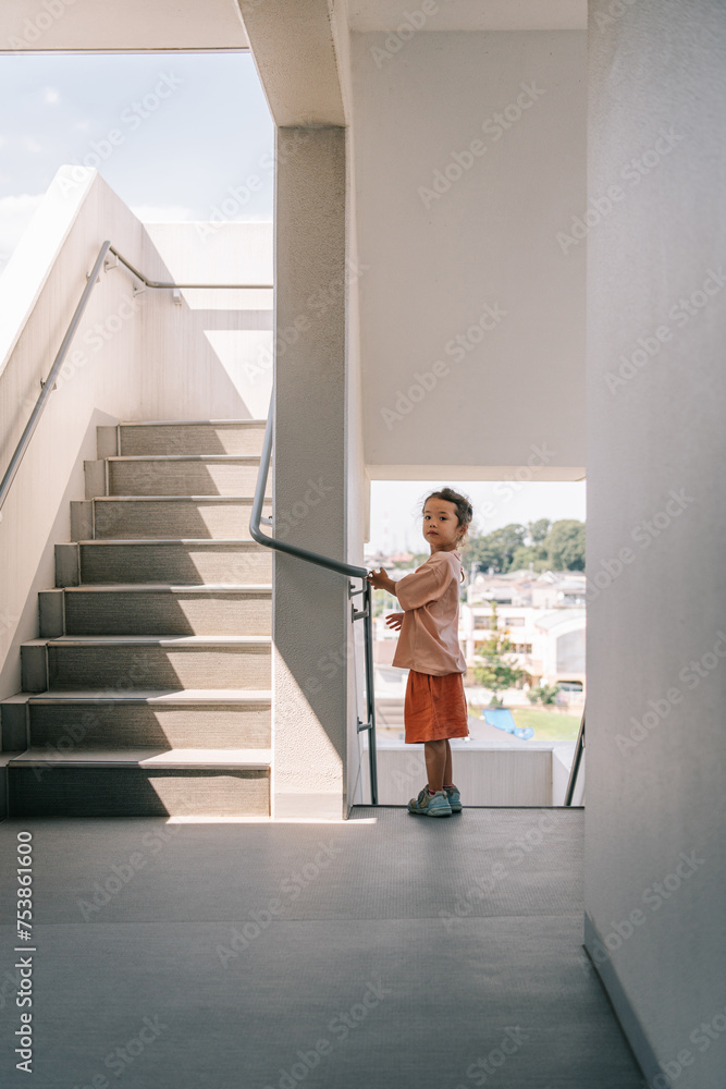 Toddler standing in the hallway Toddler standing in the hallway