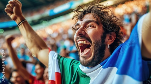 A happy fan at a public event in a stadium, holding an Italian flag with a smile and making a gesture, while enjoying the fun and leisure with a cheering crowd. AIG41