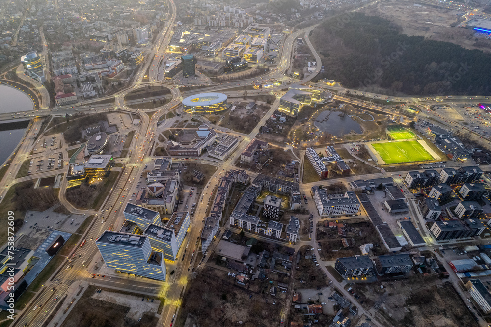 Fototapeta premium Aerial spring view of sunset dusk in Vilnius city center, down town, Šnipiškės district, Lithuania