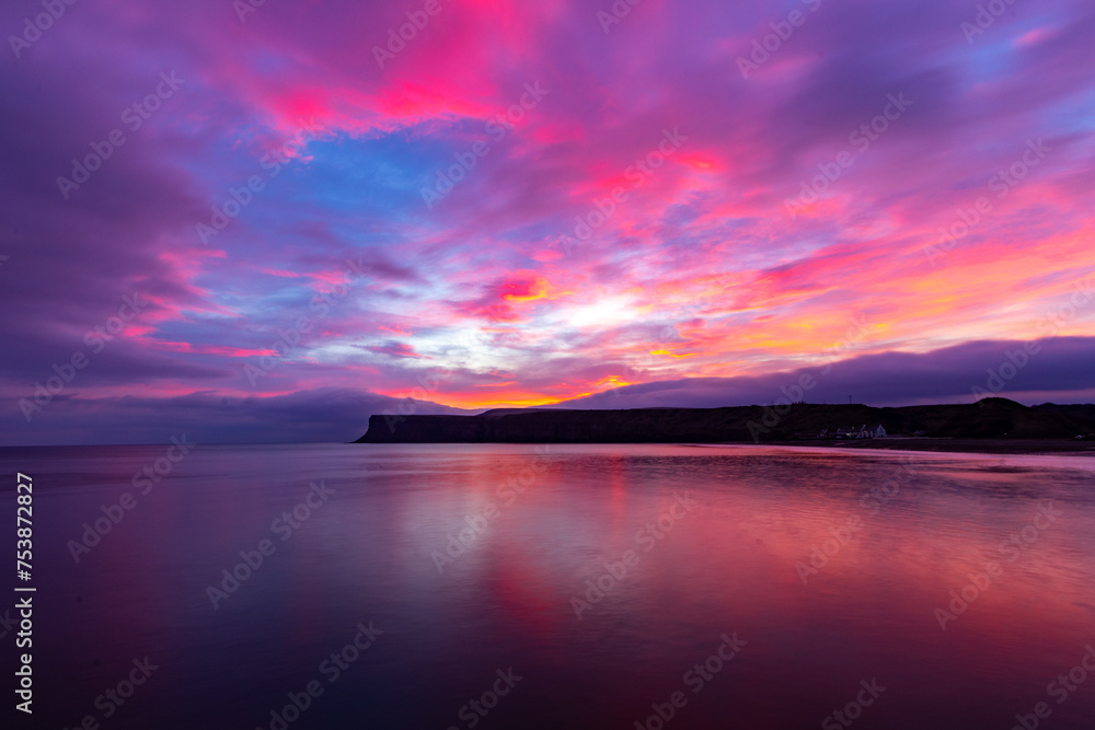 Colourful sunrise over the sea at Saltburn in the North East UK.
